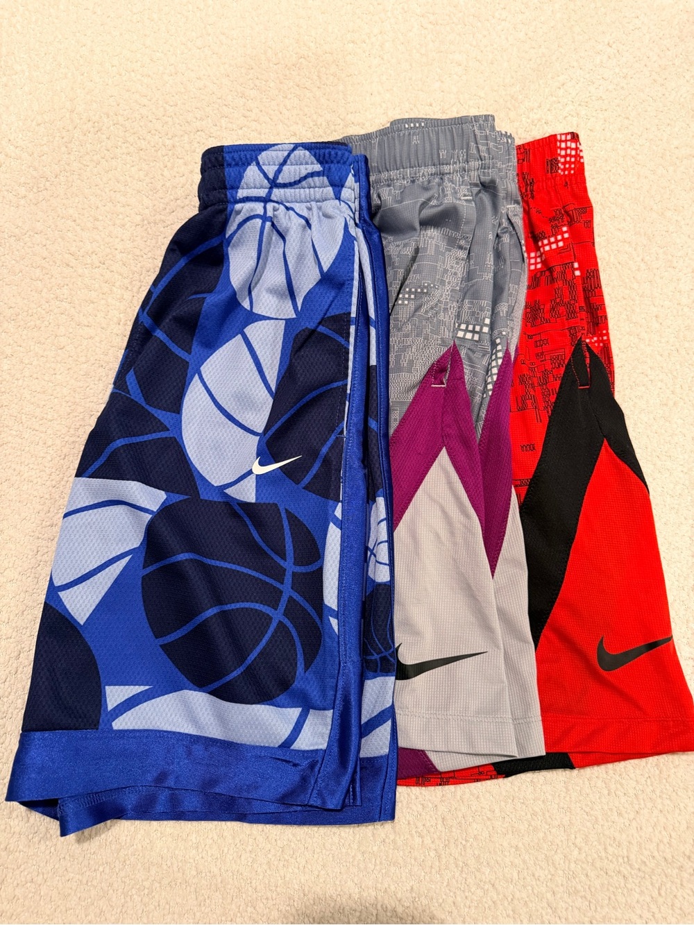 3 Nike Kids Athletic Shorts: Blue, Gray/purple and Red